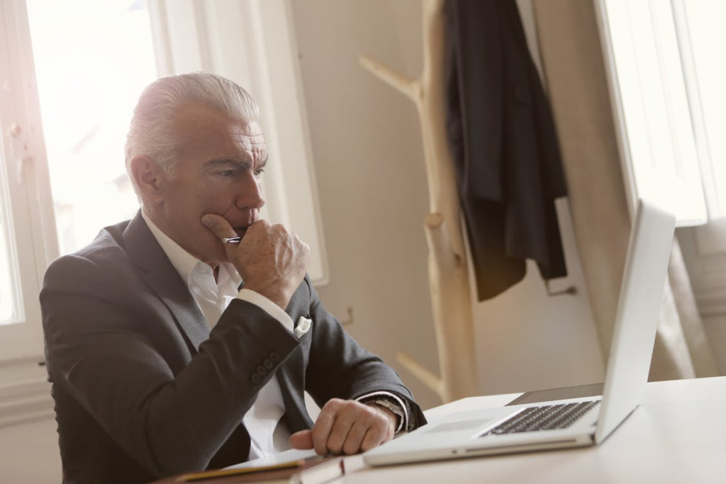 Man looking at the laptop