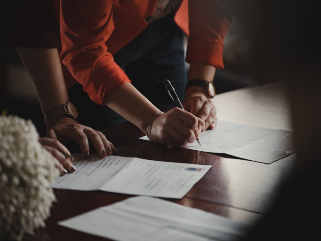 A person signing legal documents