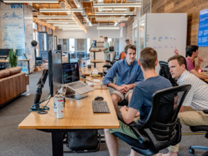 Employees involved in a discussion at the office