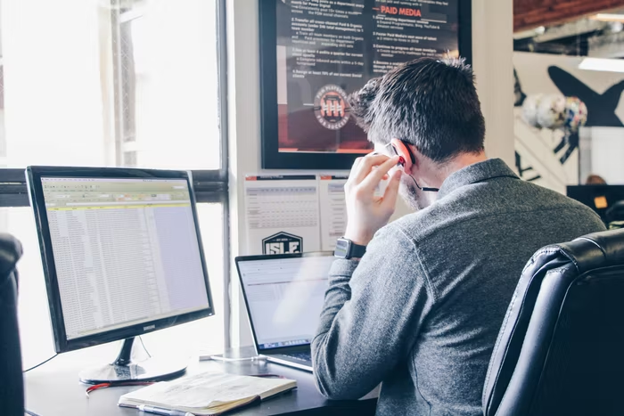 a man filing their taxes on their computer