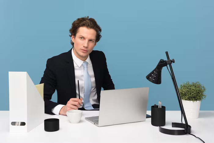 a man using a laptop on a table