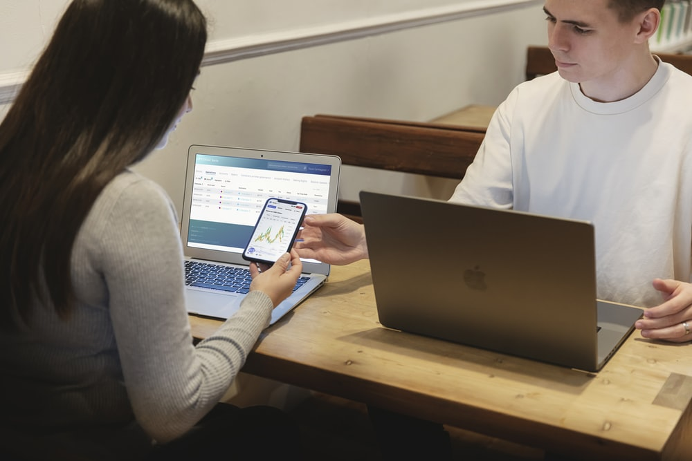 a man and woman filing their taxes