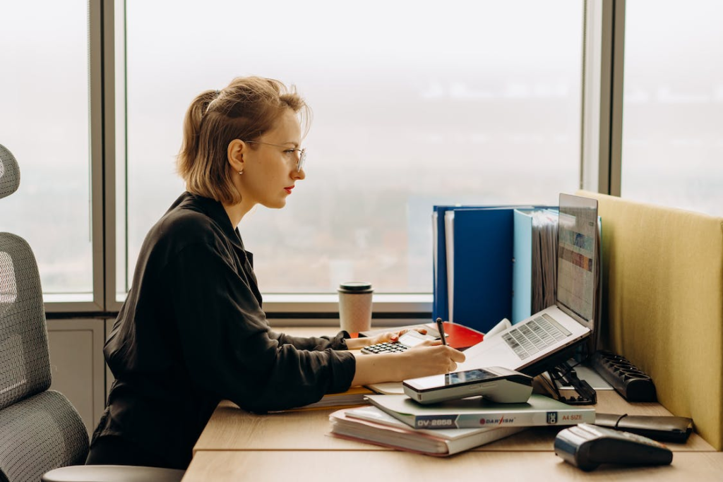 A young woman on her laptop in the office