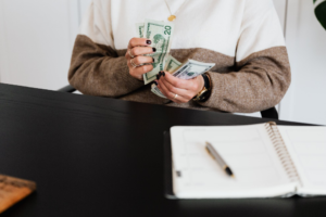  Person holding currency bills