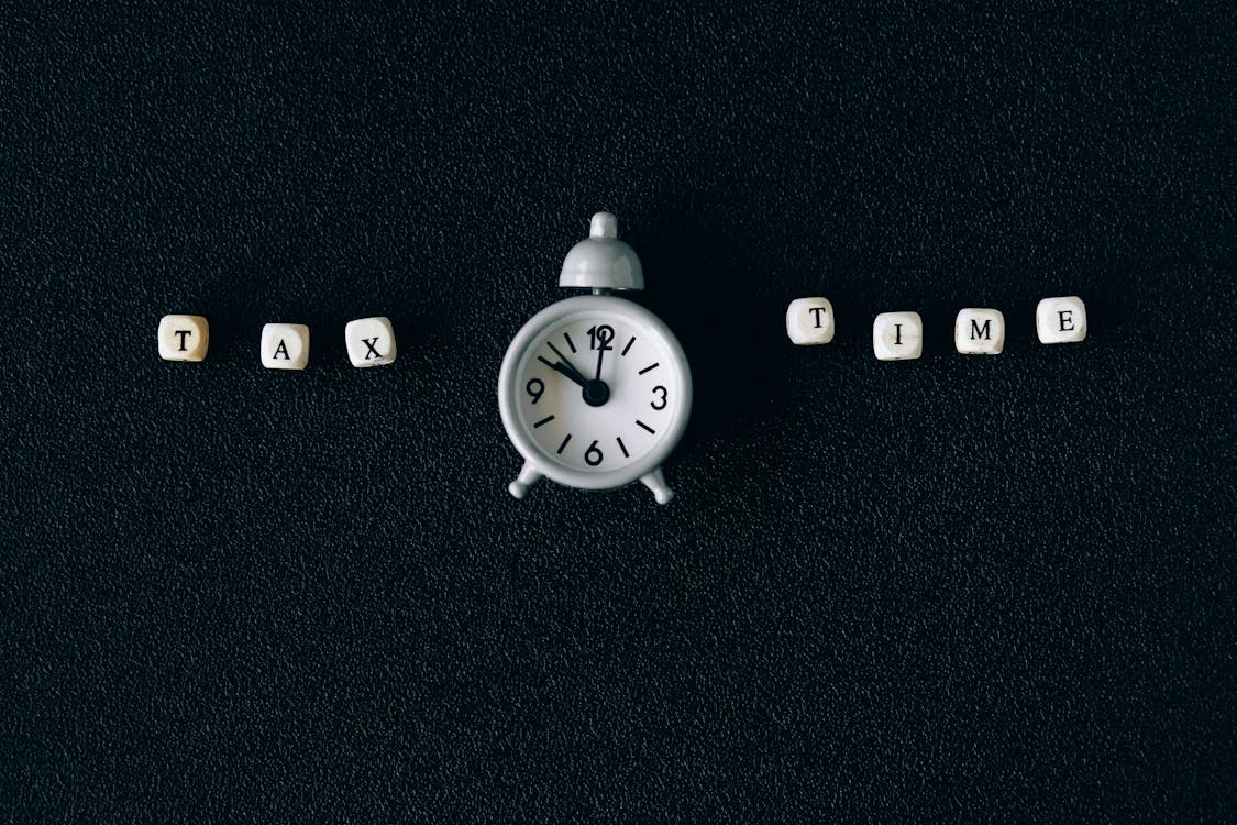White clock with tax time written beside it.