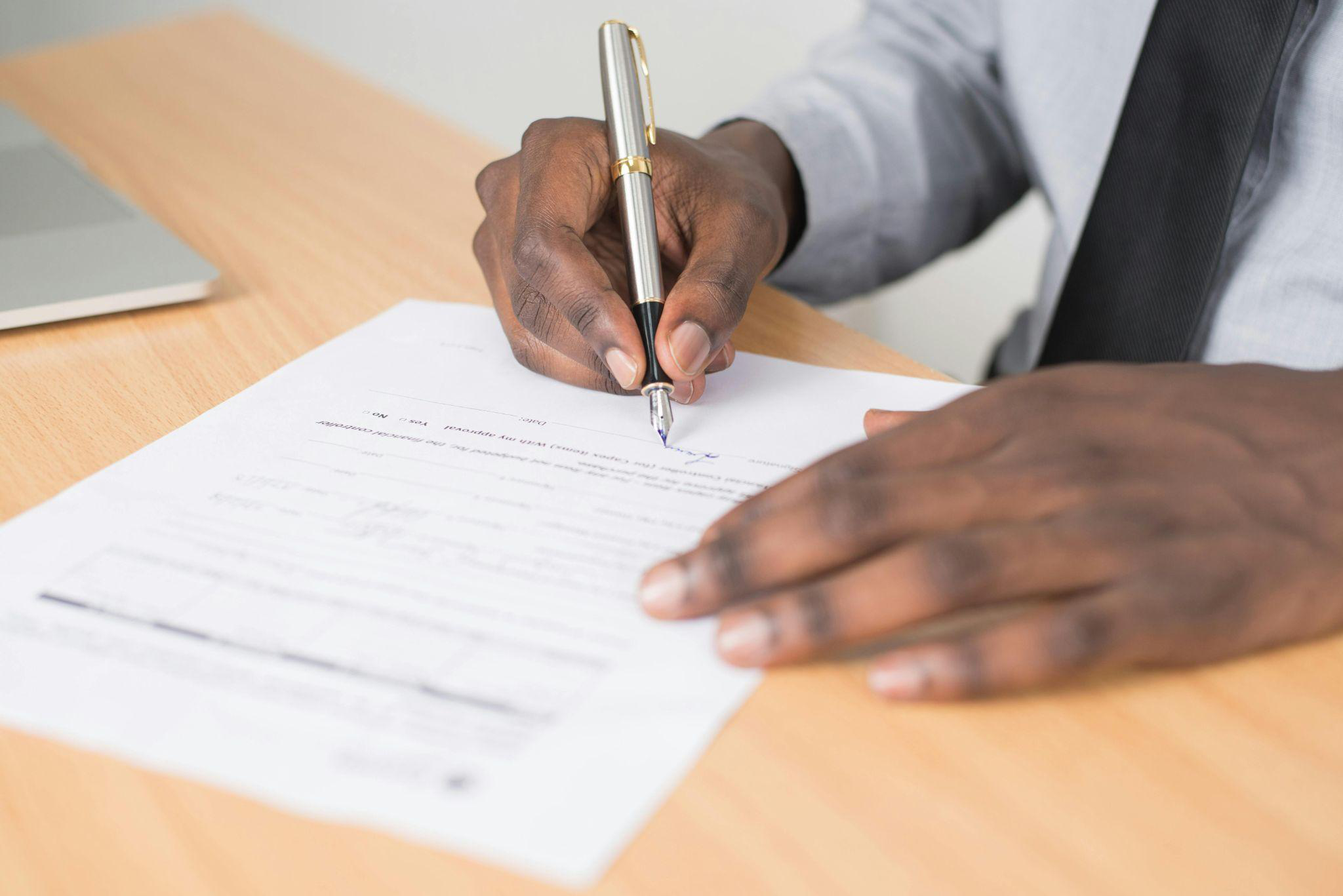 A person filling out paperwork