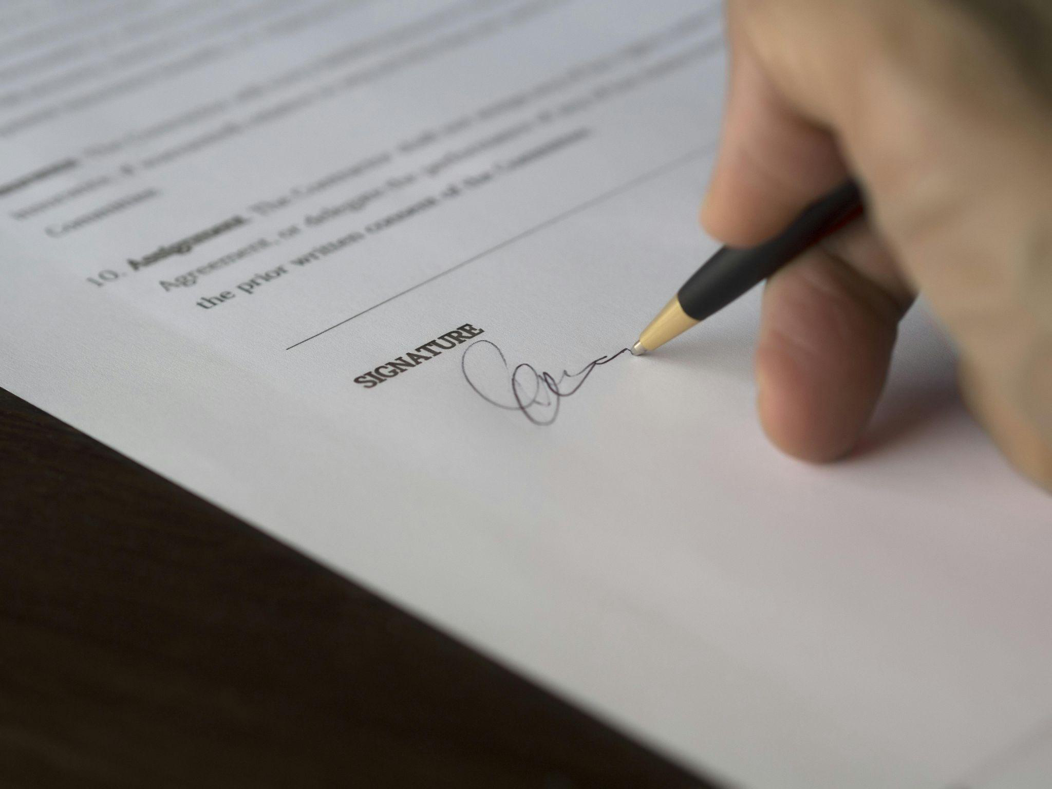 A person signing a document