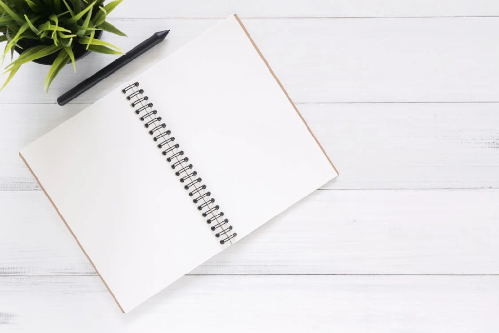 an open notebook and pen