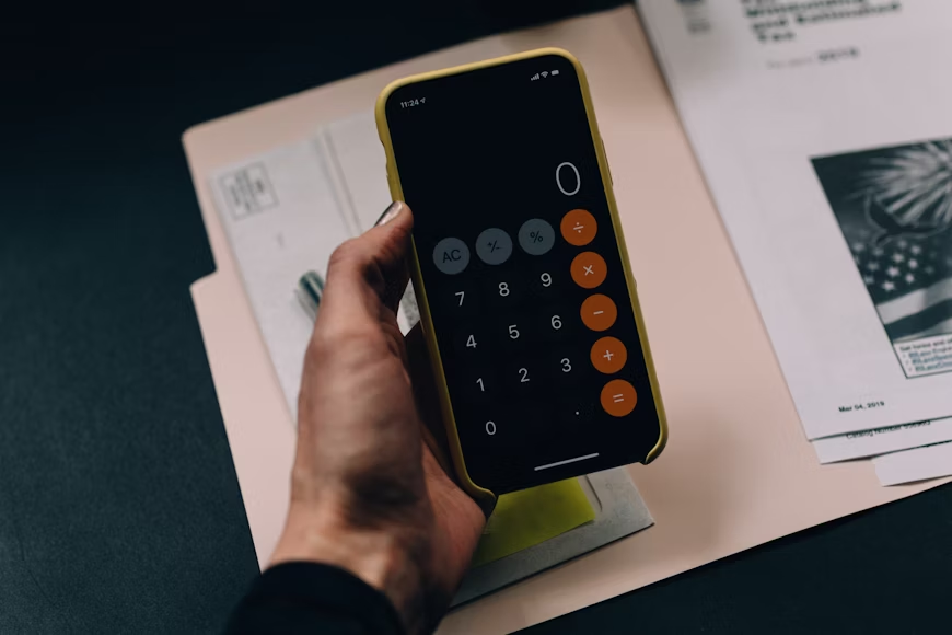 a person using a calculator on their phone
