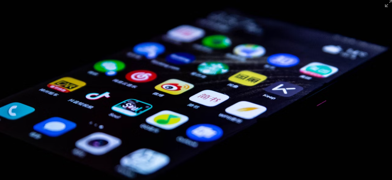 This image shows black mobile with many apps.