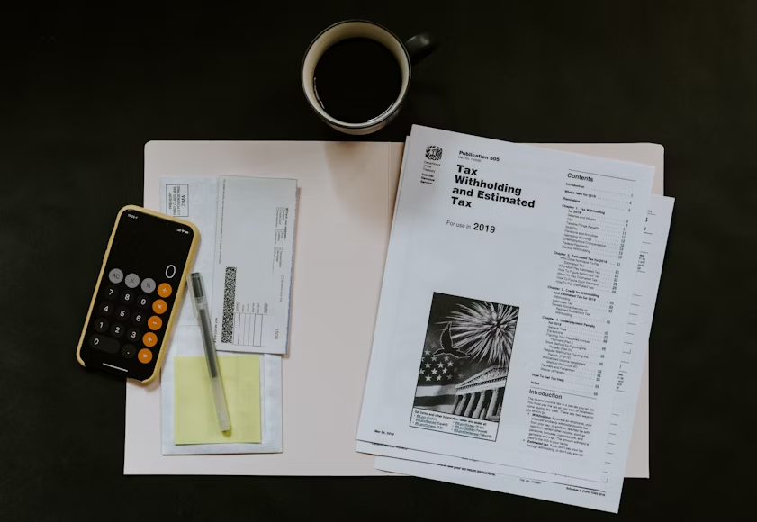 tax documents with a coffee mug
