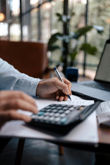 Accountant reviewing business financial statements and tax documents