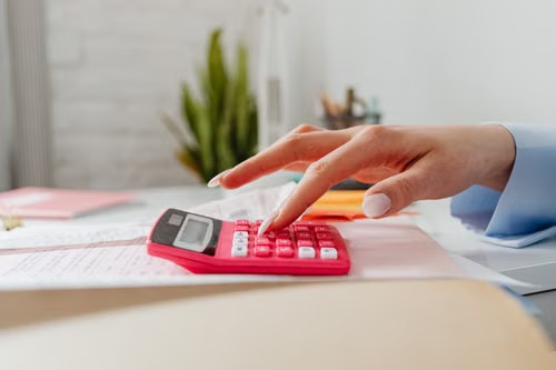 An accountant using a calculator