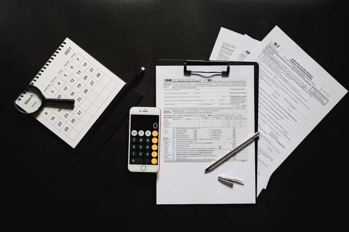 This photo shows some tax documents on a table.